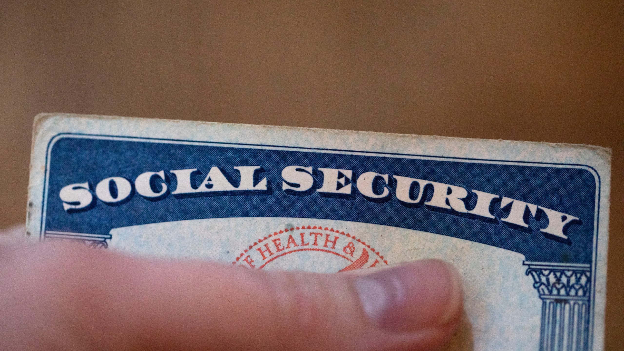 This Tuesday, Oct. 12, 2021, photo shows a Social Security card in Tigard, Ore. Millions of retirees on Social Security will get a 5.9% boost in benefits for 2022. The biggest cost-of-living adjustment in 39 years follows a burst in inflation as the economy struggles to shake off the drag of the coronavirus pandemic. (AP Photo/Jenny Kane)