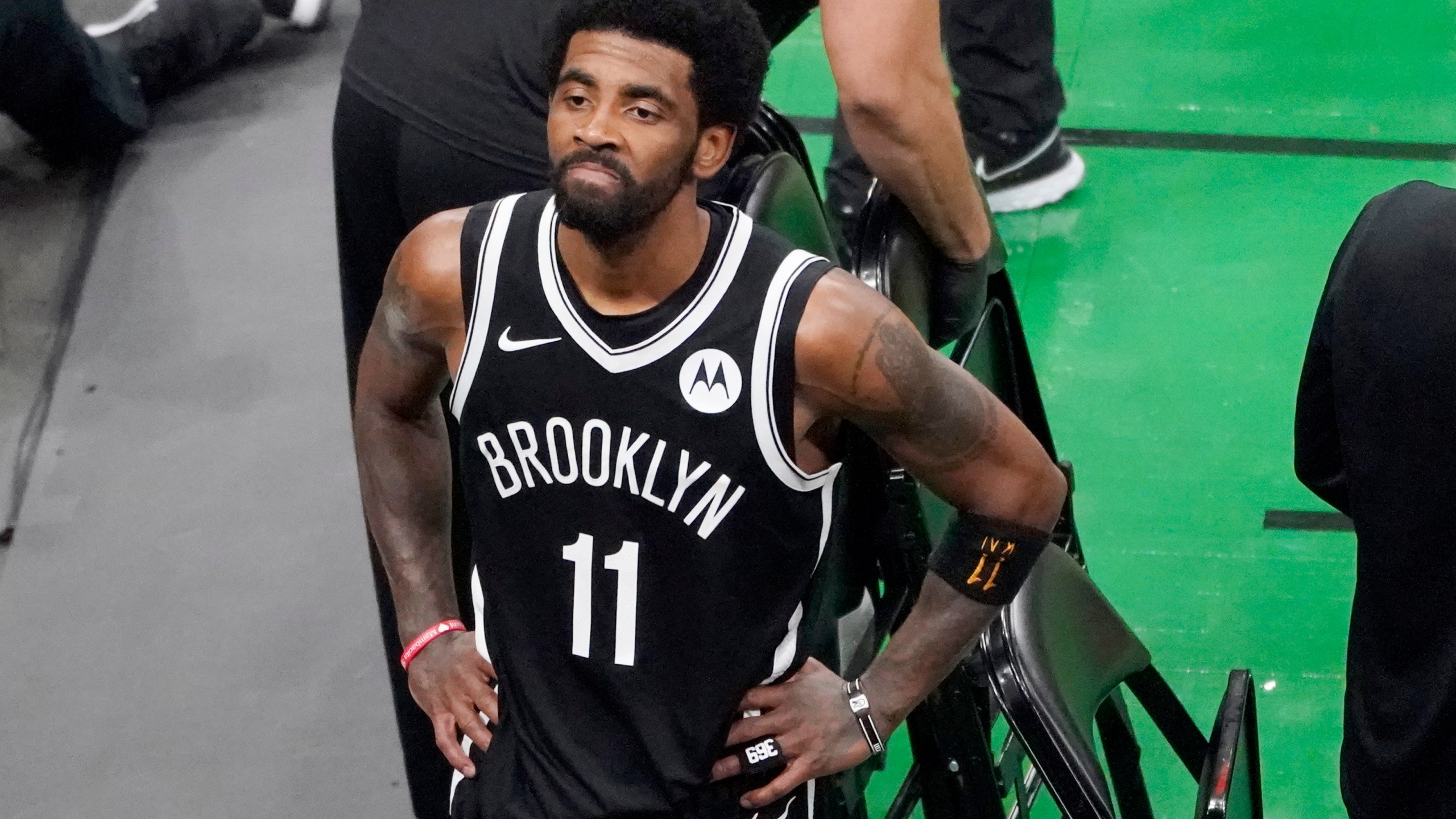 Brooklyn Nets guard Kyrie Irving looks up at the fans at TD Garden after they defeated the Boston Celtics in Game 4 during an NBA basketball first-round playoff series in Boston, in this Sunday, May 30, 2021, file photo. (AP Photo/Elise Amendola, File)