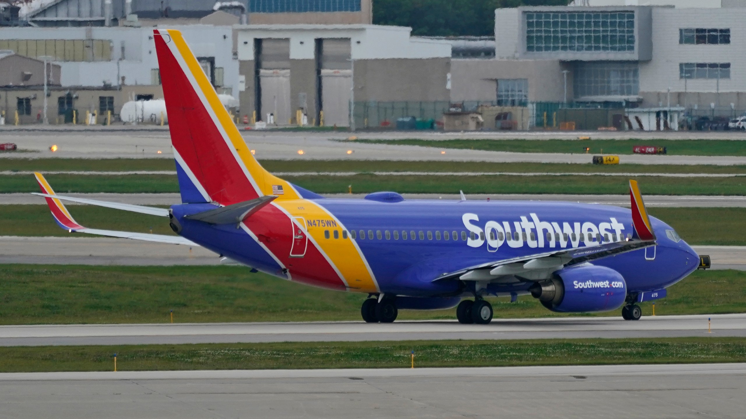 A Southwest Airlines jetliner taxis down a runway at Cleveland Hopkins International Airport, Tuesday, Oct. 12, 2021, in Cleveland. Southwest Airlines appears to be fixing problems that caused the cancellation of nearly 2,400 flights over the previous three days. (AP Photo/Tony Dejak)