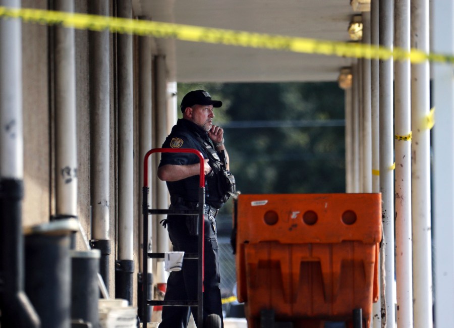 Memphis Police Department officers work the scene of a post office after a shooting, Tuesday, Oct. 12, 2021 in the Orange Mound neighborhood of Memphis, Tenn. Police investigated a shooting Tuesday at a post office in an historic neighborhood of Memphis, Tennessee, the third high-profile shooting in the region in weeks.(Patrick Lantrip/Daily Memphian via AP)