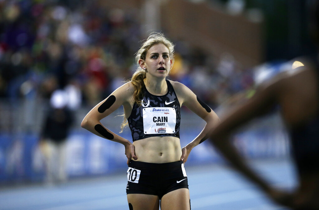 In this April 29, 2016, file photo, Mary Cain walks off the track after competing in the women's special 1500-meter run at the Drake Relays athletics meet in Des Moines, Iowa. (AP Photo/Charlie Neibergall, File)