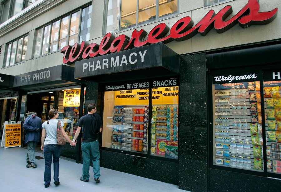 In this June 26, 2006 file photo, window shoppers look at a Walgreens storefront in San Francisco. (AP Photo/Ben Margot, File)