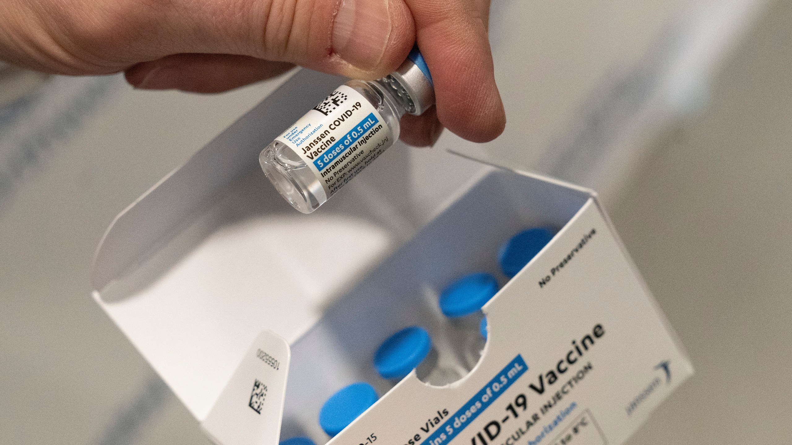 In this March 3, 2021 file photo, a pharmacist holds a vial of the Johnson & Johnson COVID-19 vaccine at a hospital in Bay Shore, N.Y. (Mark Lennihan/Associated Press)