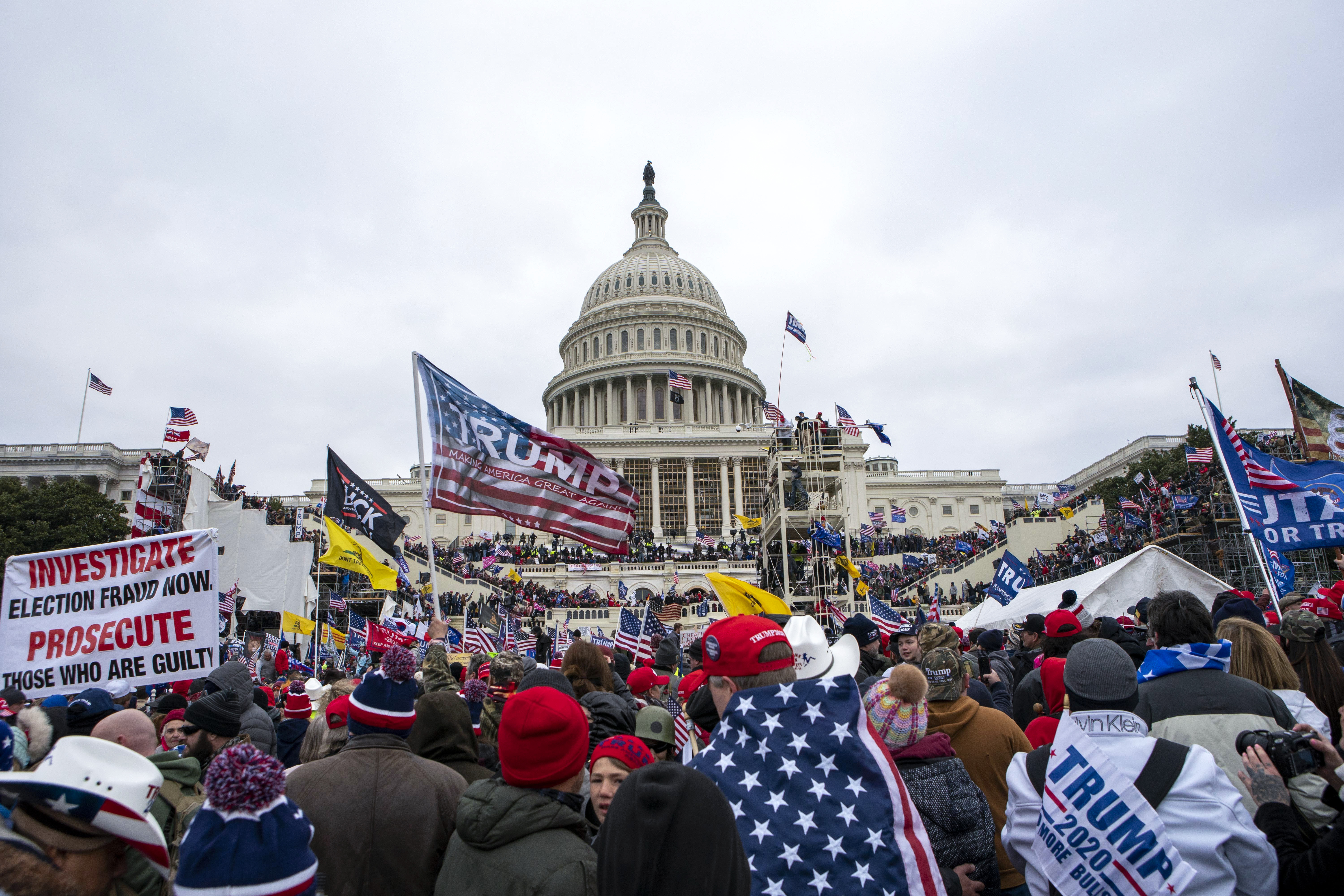 In this Jan. 6, 2021, file photo insurrections loyal to President Donald Trump rally at the U.S. Capitol in Washington. A federal judge held the director of the District of Columbia’s Department of Corrections and the warden of the city’s jail in contempt of court on Wednesday, Oct. 13, and asked the Justice Department to investigate whether the civil rights of inmates are being abused. U.S. District Judge Royce Lamberth had hauled the jail officials into court as part of the criminal case into Christopher Worrell, a member of the Proud Boys who has been charged in the Jan. 6 attack at the U.S. Capitol. (AP Photo/Jose Luis Magana, File)