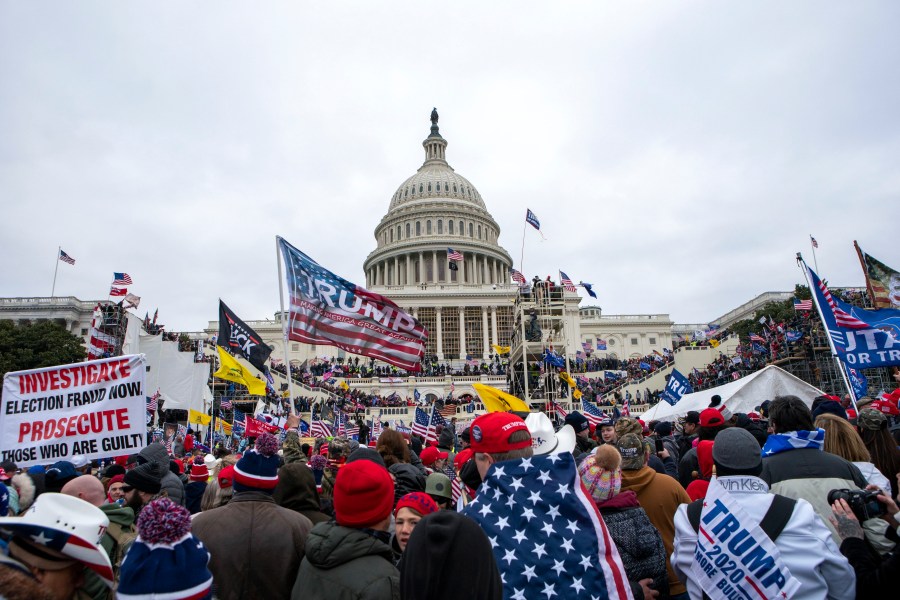 In this Jan. 6, 2021, file photo insurrections loyal to President Donald Trump rally at the U.S. Capitol in Washington. A federal judge held the director of the District of Columbia’s Department of Corrections and the warden of the city’s jail in contempt of court on Wednesday, Oct. 13, and asked the Justice Department to investigate whether the civil rights of inmates are being abused. U.S. District Judge Royce Lamberth had hauled the jail officials into court as part of the criminal case into Christopher Worrell, a member of the Proud Boys who has been charged in the Jan. 6 attack at the U.S. Capitol. (AP Photo/Jose Luis Magana, File)