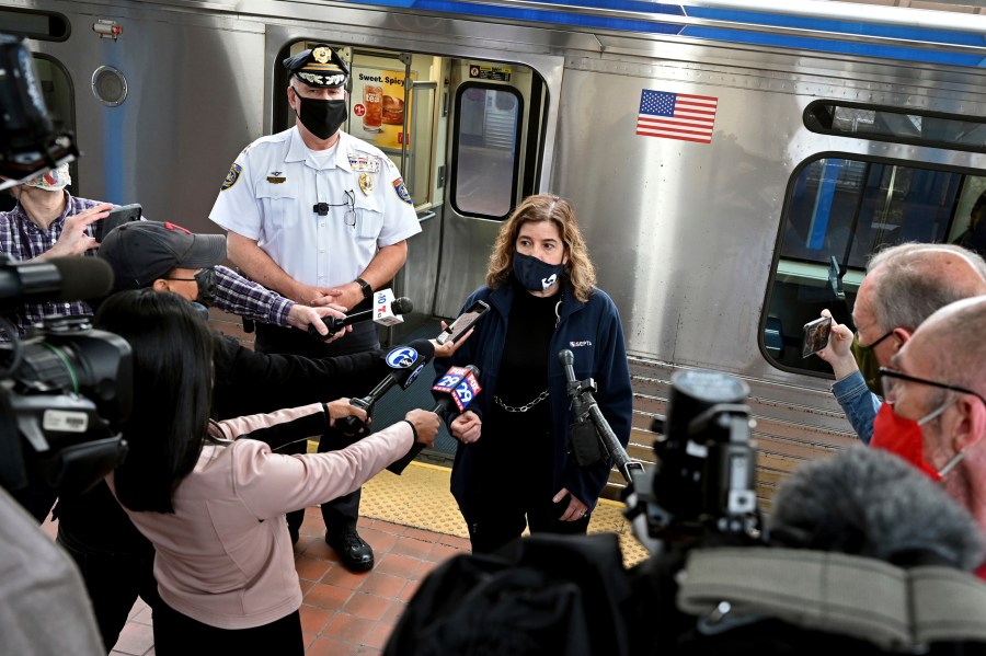 SEPTA General Manager Leslie Richards speaks during a news conference as SEPTA Transit Police Chief Thomas Nestel III stands behind her on an El platform at the 69th Street Transportation Center, Monday, Oct. 18, 2021, in Philadelphia, following a brutal rape on the El, as other riders watched, over the weekend. They discussed the emergency call boxes on SEPTA trains and how to properly contact police from the trains. (Tom Gralish/The Philadelphia Inquirer via AP)