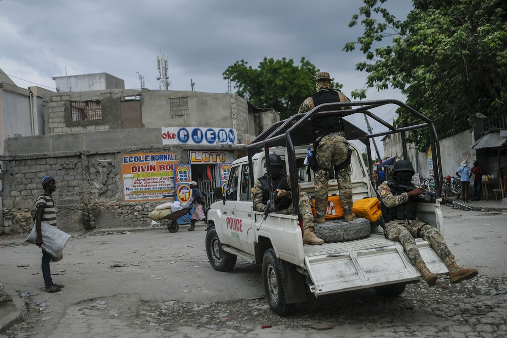 Security forces patrol the streets of Croix-des-Bouquets, near Port-au-Prince, Haiti, Tuesday, Oct. 19, 2021. (AP Photo/Matias Delacroix)