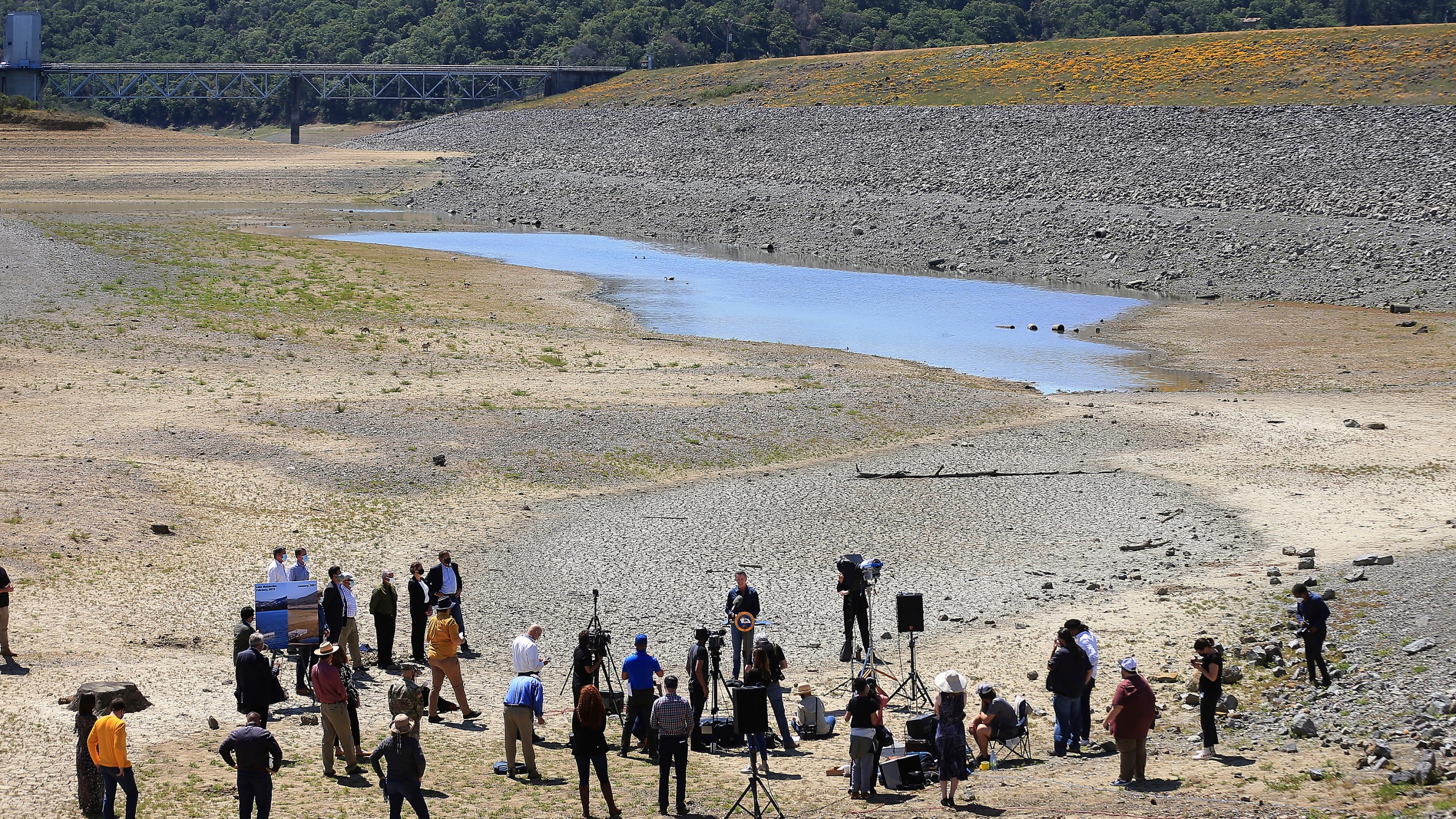 In this April 21, 2021, file photo, California Gov. Gavin Newsom holds a news conference in the parched basin of Lake Mendocino in Ukiah, Calif., where he announced he would proclaim a drought emergency for Mendocino and Sonoma counties. (Kent Porter/The Press Democrat via AP, File)