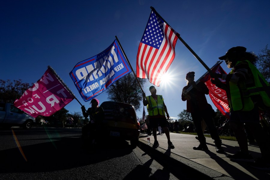 In this Jan. 6, 2021 file photo, people attend a rally in support of President Donald Trump outside Thousand Oaks City Hall in Thousand Oaks, Calif. (AP Photo/Ashley Landis, File)