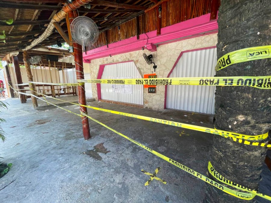 Police security tape covers the exterior of a restaurant the day after a fatal shooting in Tulum, Mexico, Friday, Oct. 22, 2021. (AP Photo/Christian Rojas)