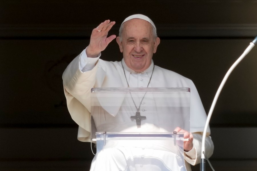 Pope Francis delivers his blessing as he recites the Angelus noon prayer from the window of his studio overlooking St.Peter's Square, at the Vatican, Sunday, Oct. 24, 2021. (AP Photo/Andrew Medichini)