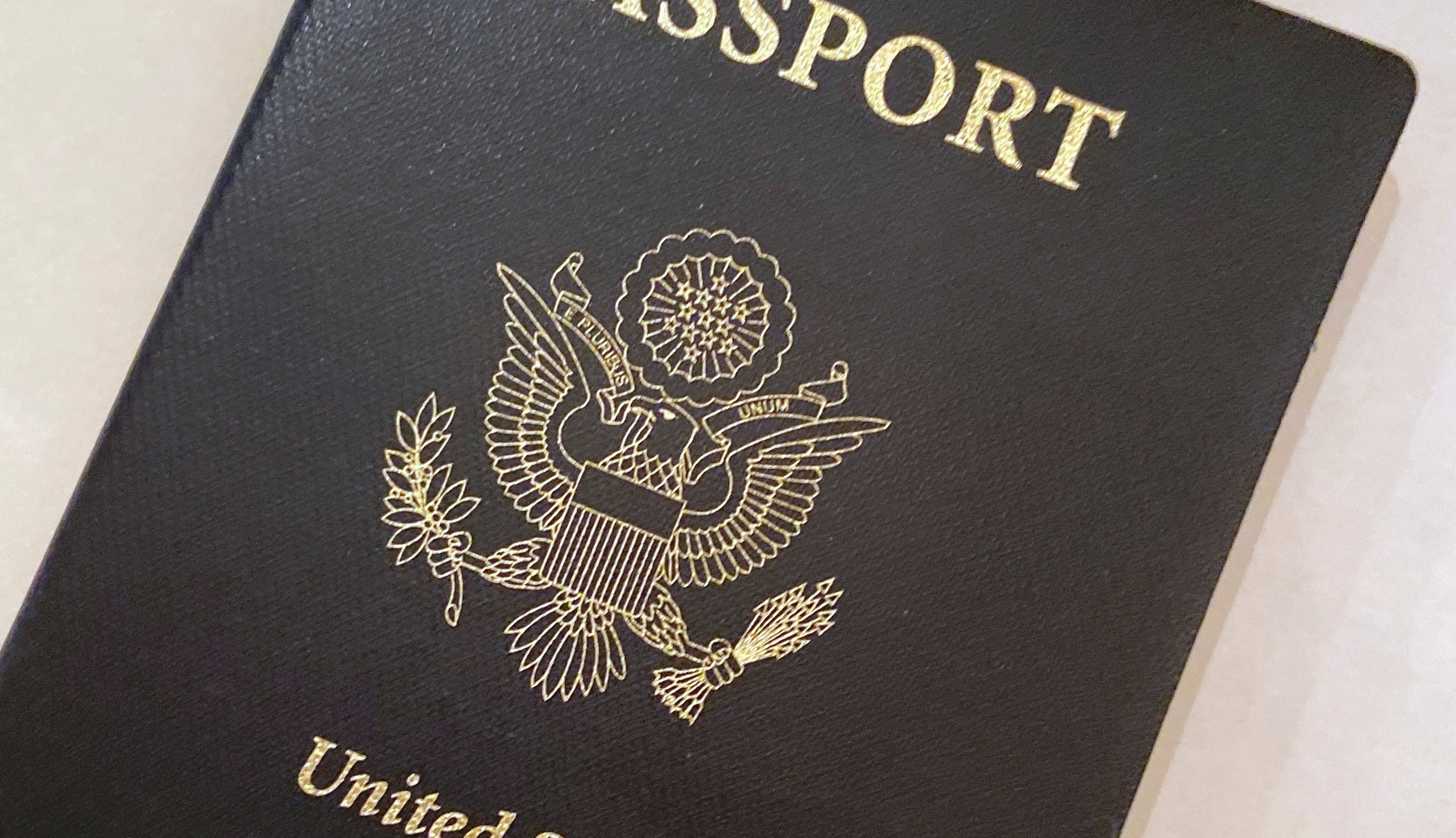 This May 25, 2021 file photo shows a U.S. Passport cover in Washington. The United States has issued its first passport with an “X” gender designation, a milestone in the recognition of the rights of people who don't identify as male or female. (AP Photo/Eileen Putman)