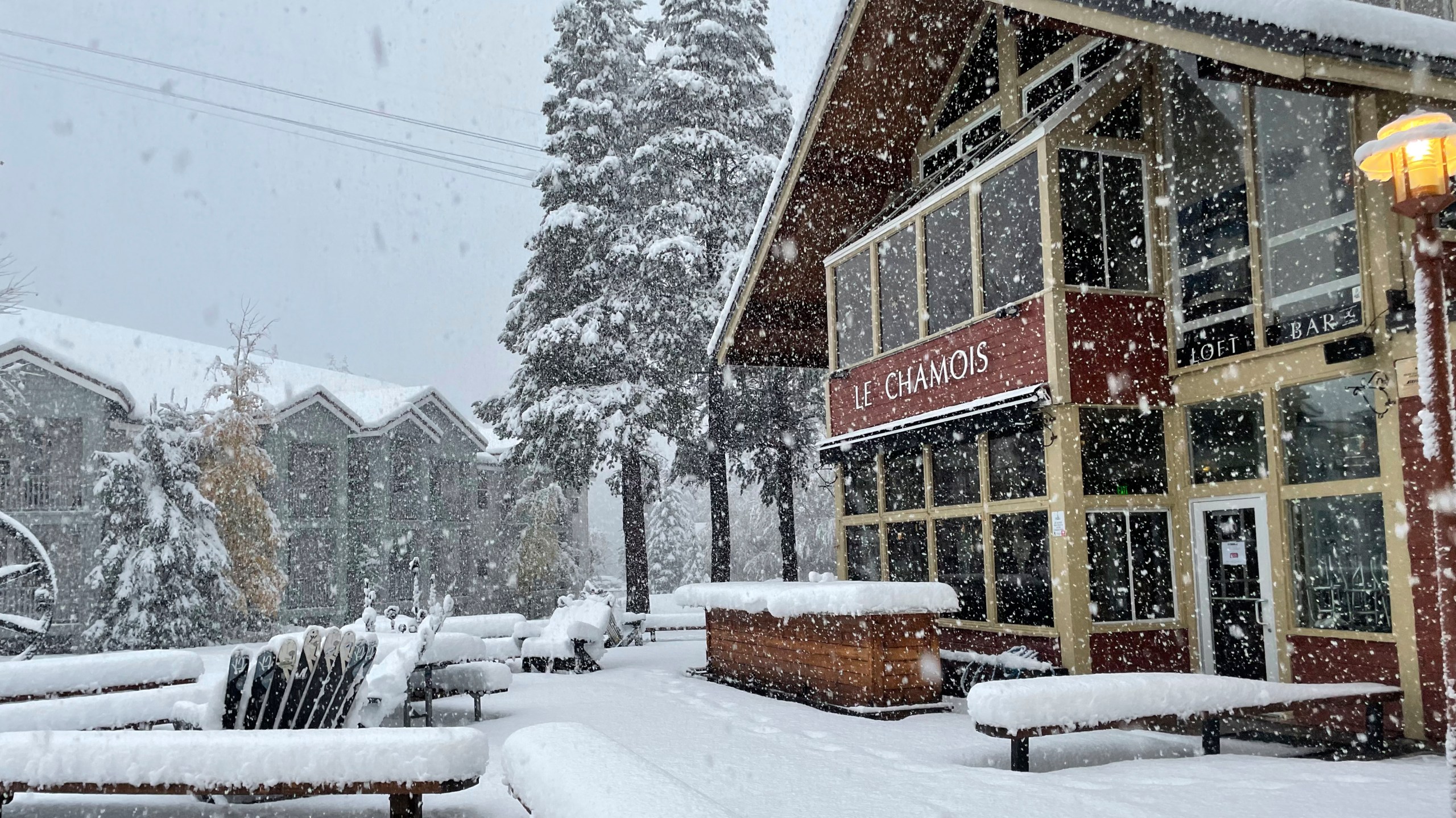 In this image taken on Oct. 25, 2021, and provided by Palisades Tahoe, snow falls at the ski resort in Olympic Valley, Calif. (Palisades Tahoe via AP)