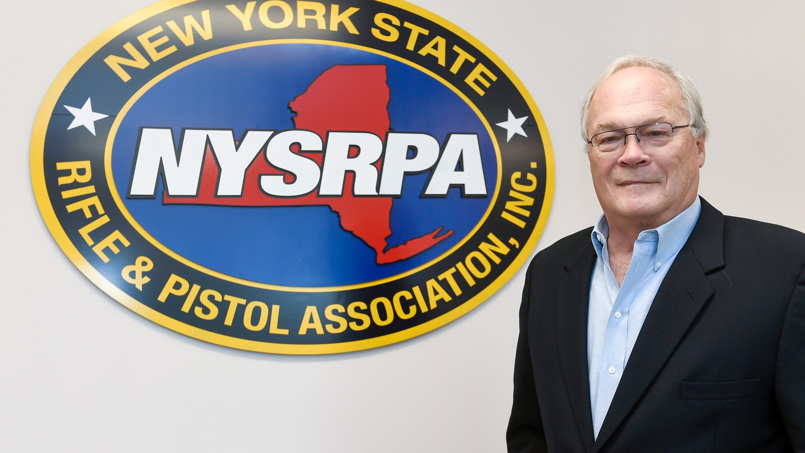 New York State Rifle & Pistol Association president Tom King poses for a photo Thursday, Oct. 28, 2021, in East Greenbush, N.Y. The Supreme Court is about to hear a gun rights case that could lead to more guns on the streets of New York and Los Angeles and threaten bans on guns in subways, airports, bars, churches, schools and other places where people gather. (AP Photo/Hans Pennink)