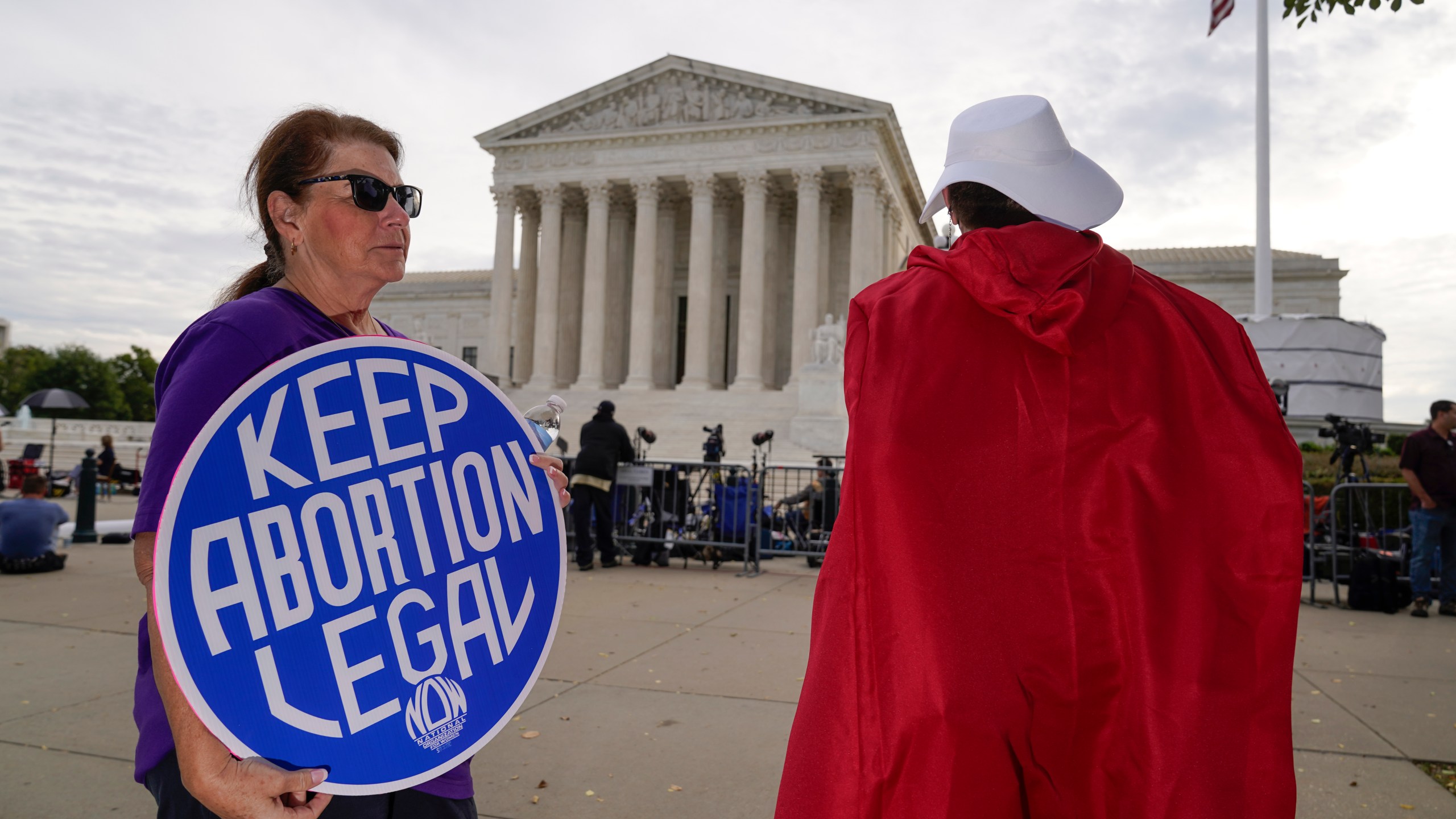 The Supreme Court is seen on the first day of the new term as activists demonstrate on the plaza, in Washington, Monday, Oct. 4, 2021. Arguments are planned for December challenging Roe v. Wade and Planned Parenthood v. Casey, the Supreme Court's major decisions over the last half-century that guarantee a woman's right to an abortion nationwide. (AP Photo/J. Scott Applewhite)