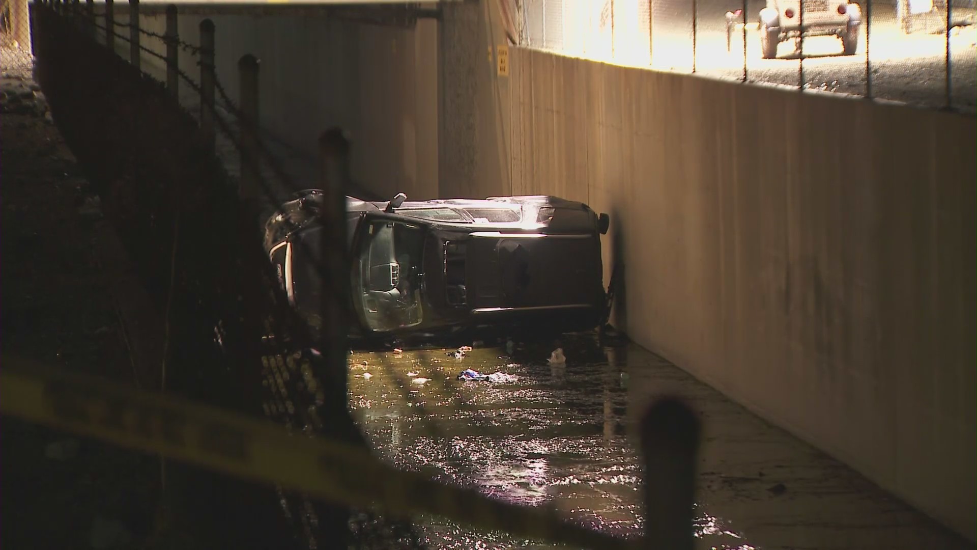 A car ending up in a drainage canal after police in Azusa shot a man on Oct. 22, 2021. (KTLA)