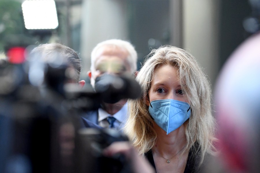 In this Tuesday, Aug. 31, 2021, file photo, Elizabeth Holmes, founder and CEO of Theranos, arrives at the federal courthouse for jury selection in her trial, in San Jose, Calif. A jury weighing the fate of fallen Silicon Valley star Holmes got its first chance Friday, Oct. 22, to listen to recordings of her boasting to investors about purported breakthroughs in a blood-testing technology. (AP Photo/Nic Coury)