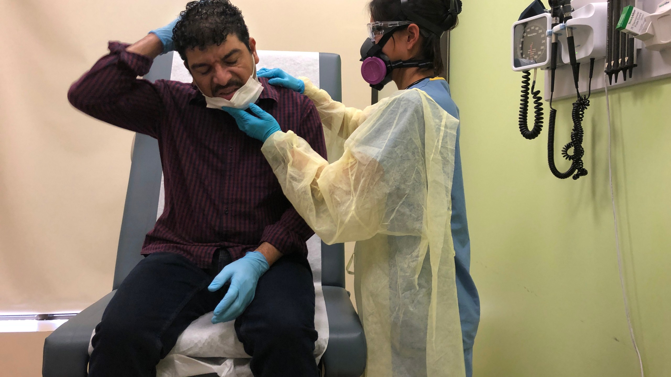 Guatemalan immigrant Marvin is checked by a physician's assistant before receiving a COVID-19 swab test at a clinic on May 5, 2020, in Stamford, Connecticut. (John Moore/Getty Images)