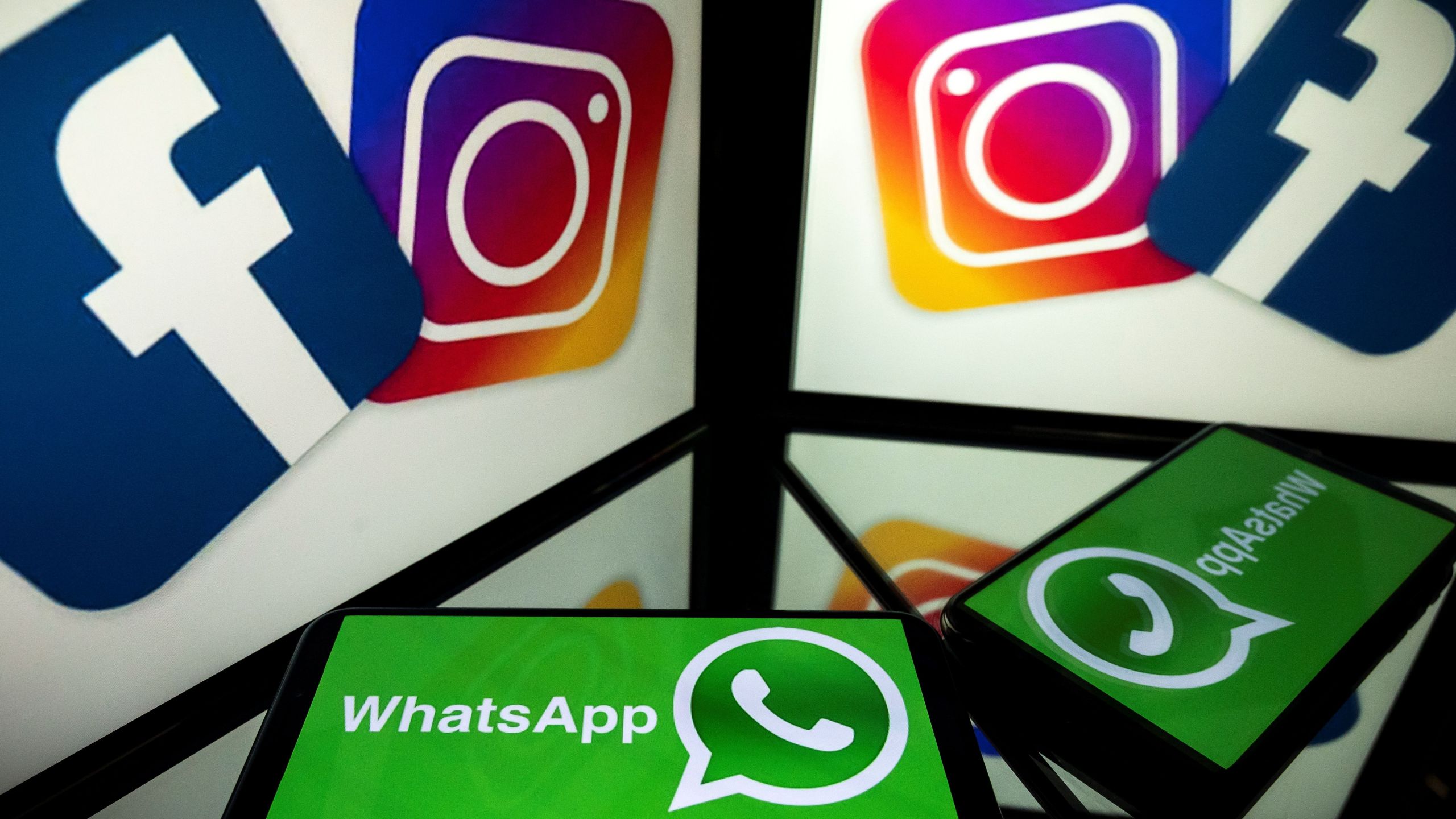 This picture, taken on Oct. 5, 2020, shows logos of social networks Facebook, Instagram and Whatsapp. (LIONEL BONAVENTURE/AFP via Getty Images)