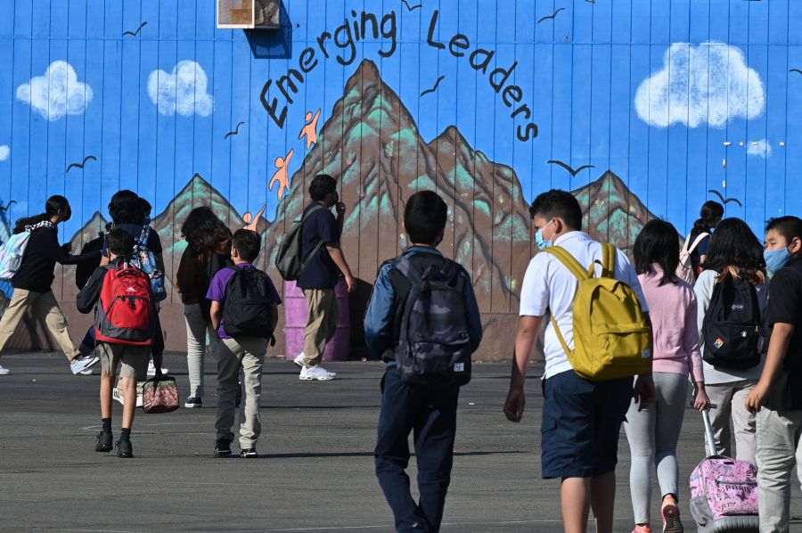 Students walk to their classrooms at a public middle school in Los Angeles on Sept. 10, 2021. (ROBYN BECK/AFP via Getty Images)