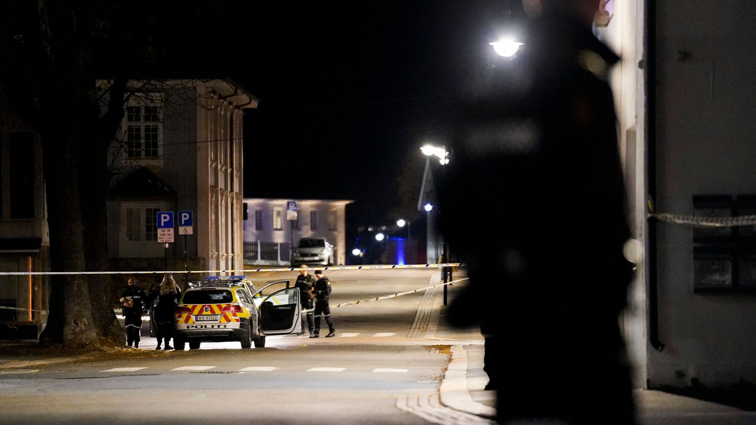 Police officers cordon off the scene where they are investigating in Kongsberg, Norway after a man armed with bow killed several people before he was arrested by police on October 13, 2021. (HAKON MOSVOLD LARSEN/NTB/AFP via Getty Images)