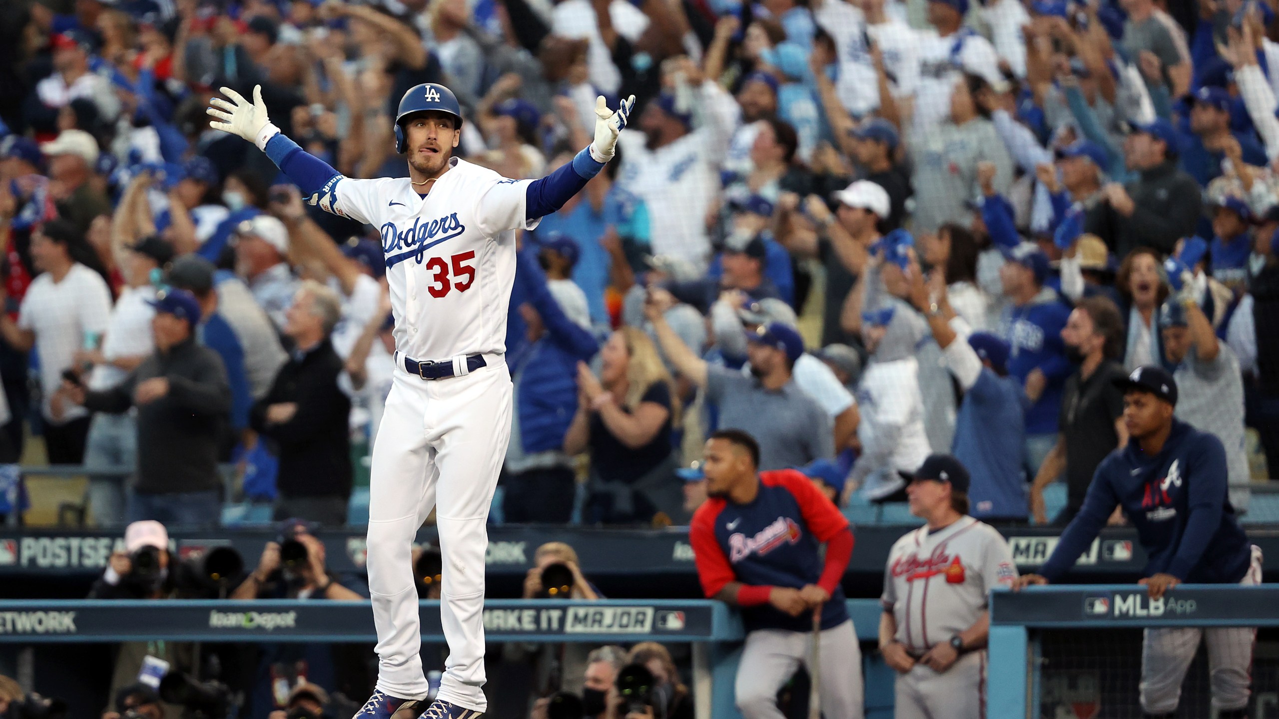 Cody Bellinger of the Los Angeles Dodgers reacts as he rounds the bases after hitting a 3-run home run during the 8th inning of Game 3 of the National League Championship Series against the Atlanta Braves at Dodger Stadium on Oct. 19, 2021. (Sean M. Haffey/Getty Images)