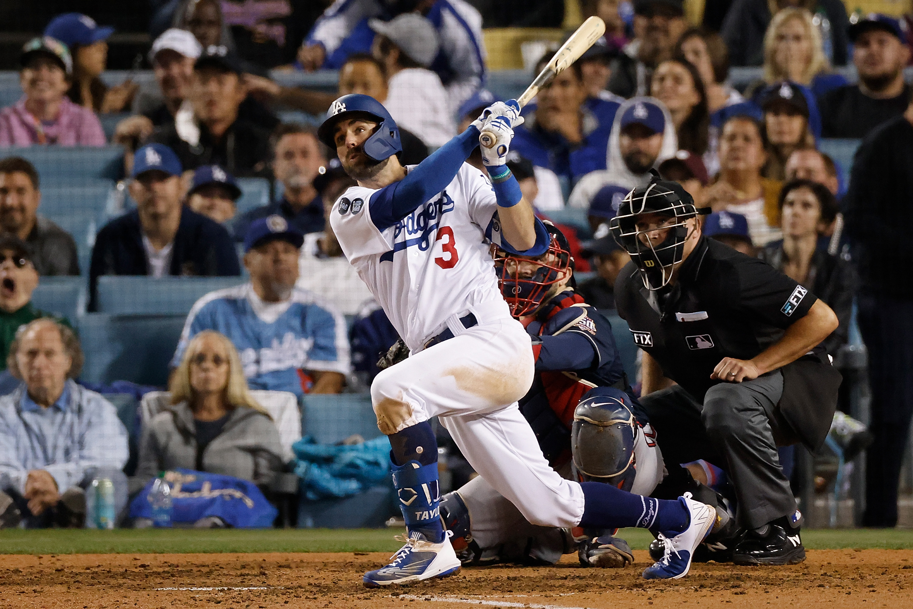 Chris Taylor #3 of the Los Angeles Dodgers hits a solo home run during the seventh inning of Game Five of the National League Championship Series against the Atlanta Braves at Dodger Stadium on Oct. 21, 2021, in Los Angeles, California. (Sean M. Haffey/Getty Images)