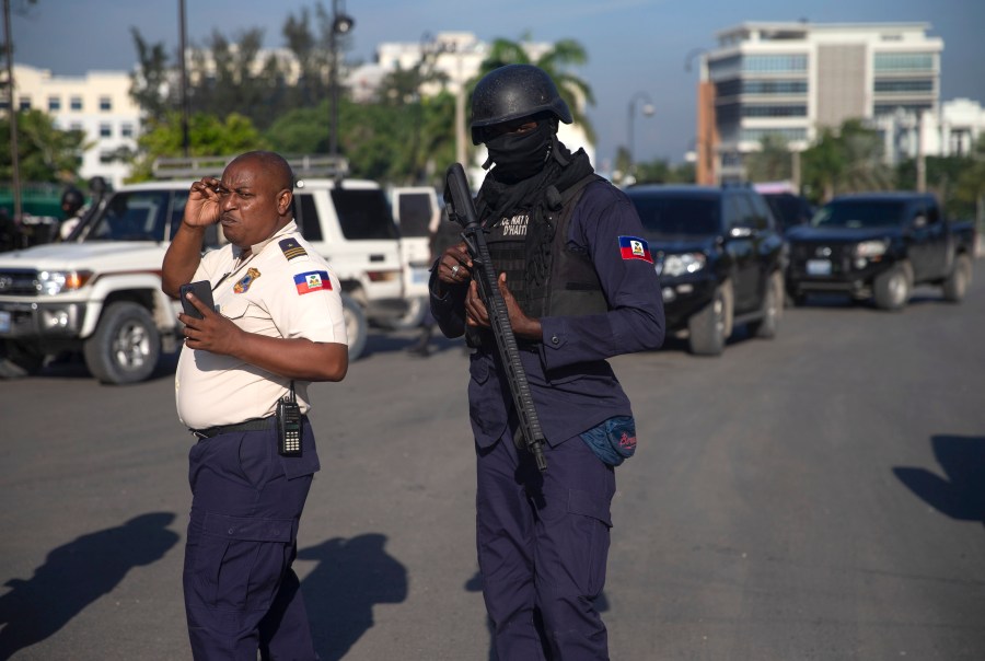 Armed forces secure the area where the Haiti's Prime Minister Ariel Henry placed a bouquet of flowers in front of independence hero Jean Jacques Dessalines memorial in Port-au-Prince, Haiti, Sunday, Oct. 17, 2021. A group of 17 missionaries including children was kidnapped by a gang in Haiti on Saturday, according to a voice message sent to various religious missions by an organization with direct knowledge of the incident. (AP Photo/Joseph Odelyn)