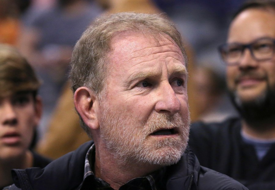 In this Dec. 11, 2019, file photo, Phoenix Suns owner Robert Sarver watches the team play against the Memphis Grizzlies during the second half of an NBA basketball game in Phoenix. The Suns released a statement regarding a potential media investigation into the workplace culture of the franchise, denying that the organization or Sarver has a history of racism or sexism. The statement sent Friday, Oct. 22, 2021, said the organization is aware that ESPN is working on a story accusing the organization of misconduct on a “variety of topics.” The Suns responded by saying they were “completely baseless claims” and “documentary evidence in our possession and eyewitness accounts directly contradict the reporter’s accusations, and we are preparing our response to his questions.” (AP Photo/Ross D. Franklin)