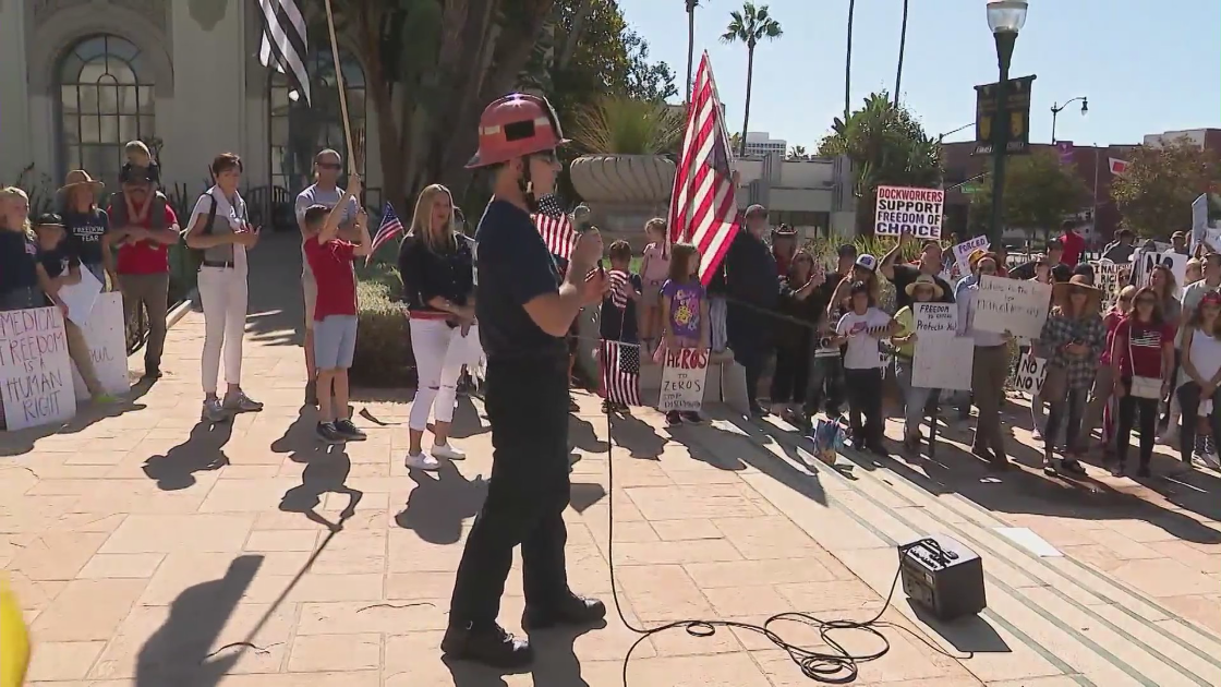 A firefighter speaks during a protest against a COVID-19 vaccine mandate for L.A. County employees on Oct. 5, 2021. (KTLA)