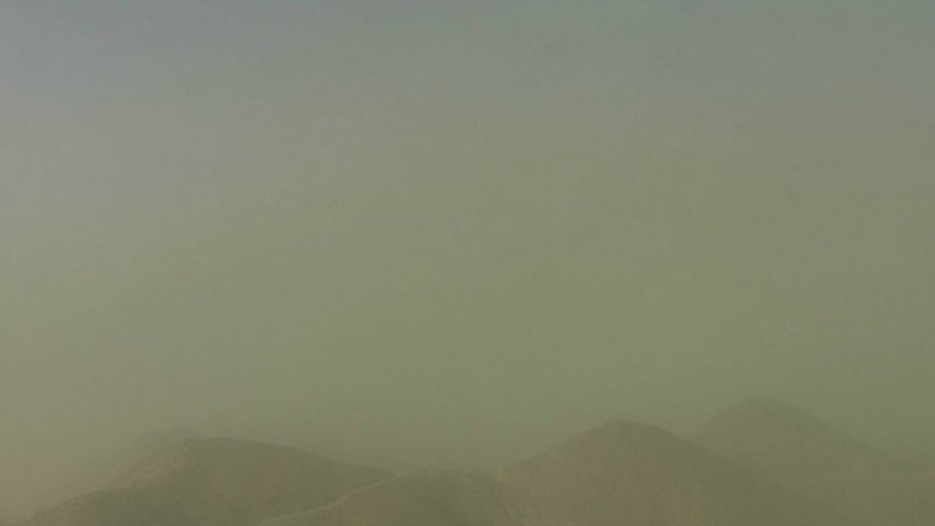 A webcam image shows the dust storm near Victorville on Oct 11, 2021. (NWS)