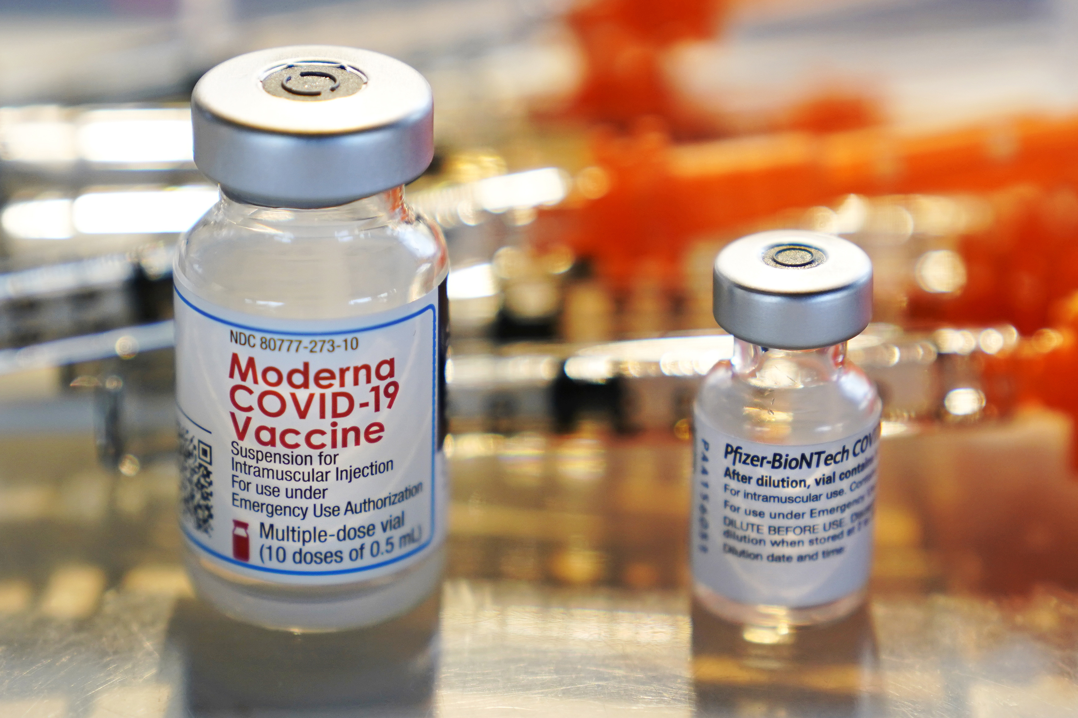 This Thursday, Feb. 25, 2021 file photo shows vials for the Moderna and Pfizer COVID-19 vaccines. (AP Photo/Charles Krupa)