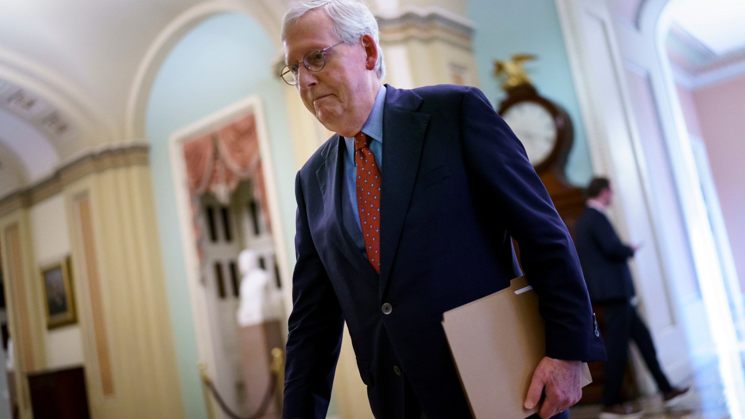 Senate Minority Leader Mitch McConnell, R-Ky., walks to the chamber for a test vote on a government spending bill, at the Capitol on Sept. 27, 2021. (J. Scott Applewhite/Associated Press)