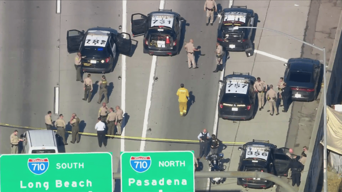 Authorities respond to a shooting at the 710 and 105 interchange in Paramount on Oct. 5, 2021. (KTLA)