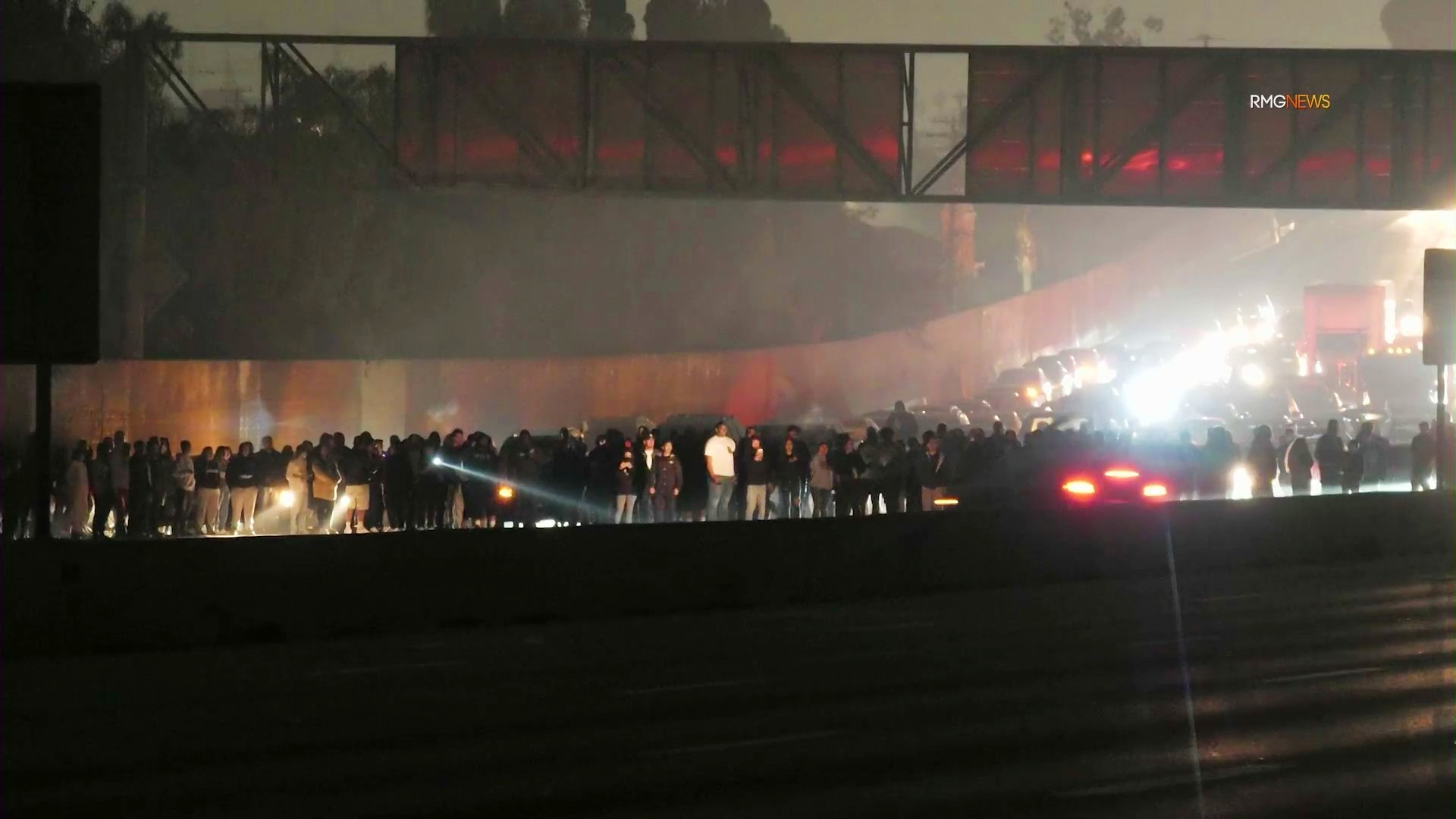 People got out of their vehicles to watch an illegal takeover of the 91 Freeway on Nov. 8, 2021. (RMG News)