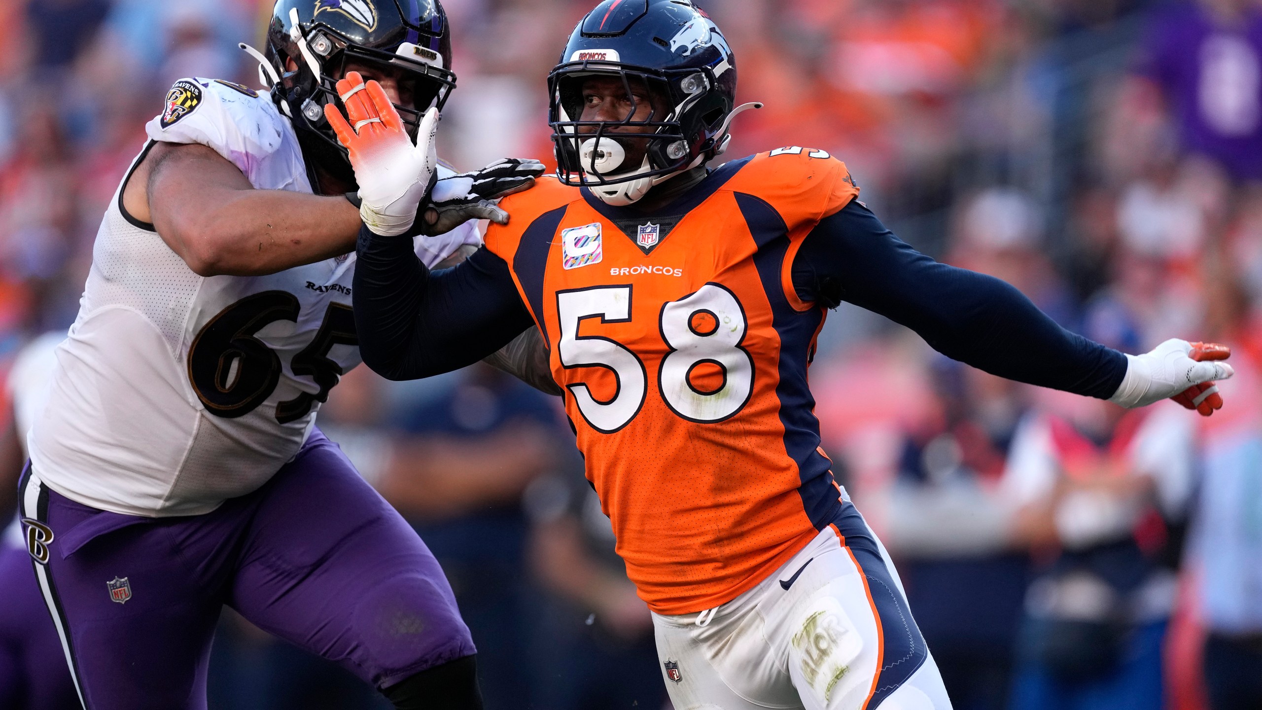 Denver Broncos outside linebacker Von Miller (58) battles against Baltimore Ravens offensive tackle Patrick Mekari (65) during the second half of an NFL football game, Sunday, Oct. 3, 2021, in Denver. (AP Photo/David Zalubowski)