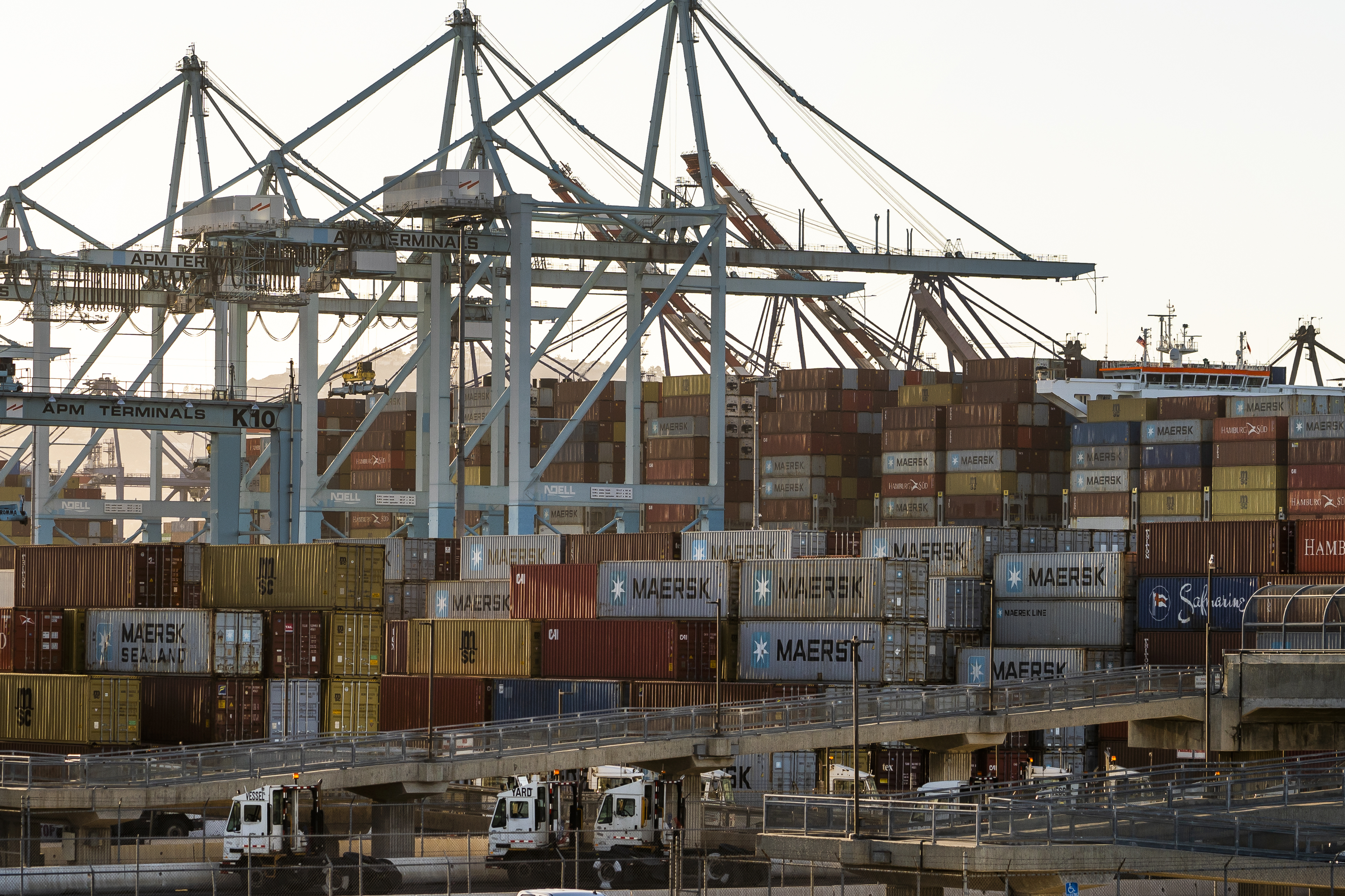 In this Tuesday, Oct. 19, 2021, photo shipping containers are stacked up at Maersk APM Terminals Pacific at the Port of Los Angeles. California Gov, Gavin Newsom on Wednesday, Oct. 20, issued an order that aims to ease bottlenecks at the ports of Los Angeles and Long Beach that have spilled over into neighborhoods where cargo trucks are clogging residential streets. (AP Photo/Damian Dovarganes)