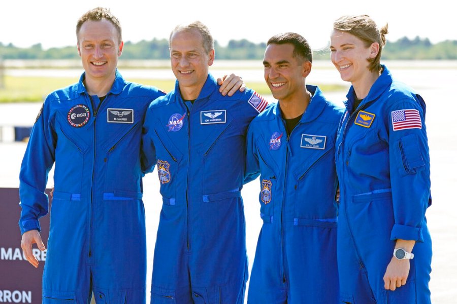 From left, European Space Agency astronaut Matthias Maurer of Germany, and NASA astronauts Tom Marshburn, Raja Chari, and Kayla Barron gather for a photo after arriving at the Kennedy Space Center in Cape Canaveral, Fla., on Tuesday, Oct. 26, 2021. (AP Photo/John Raoux)