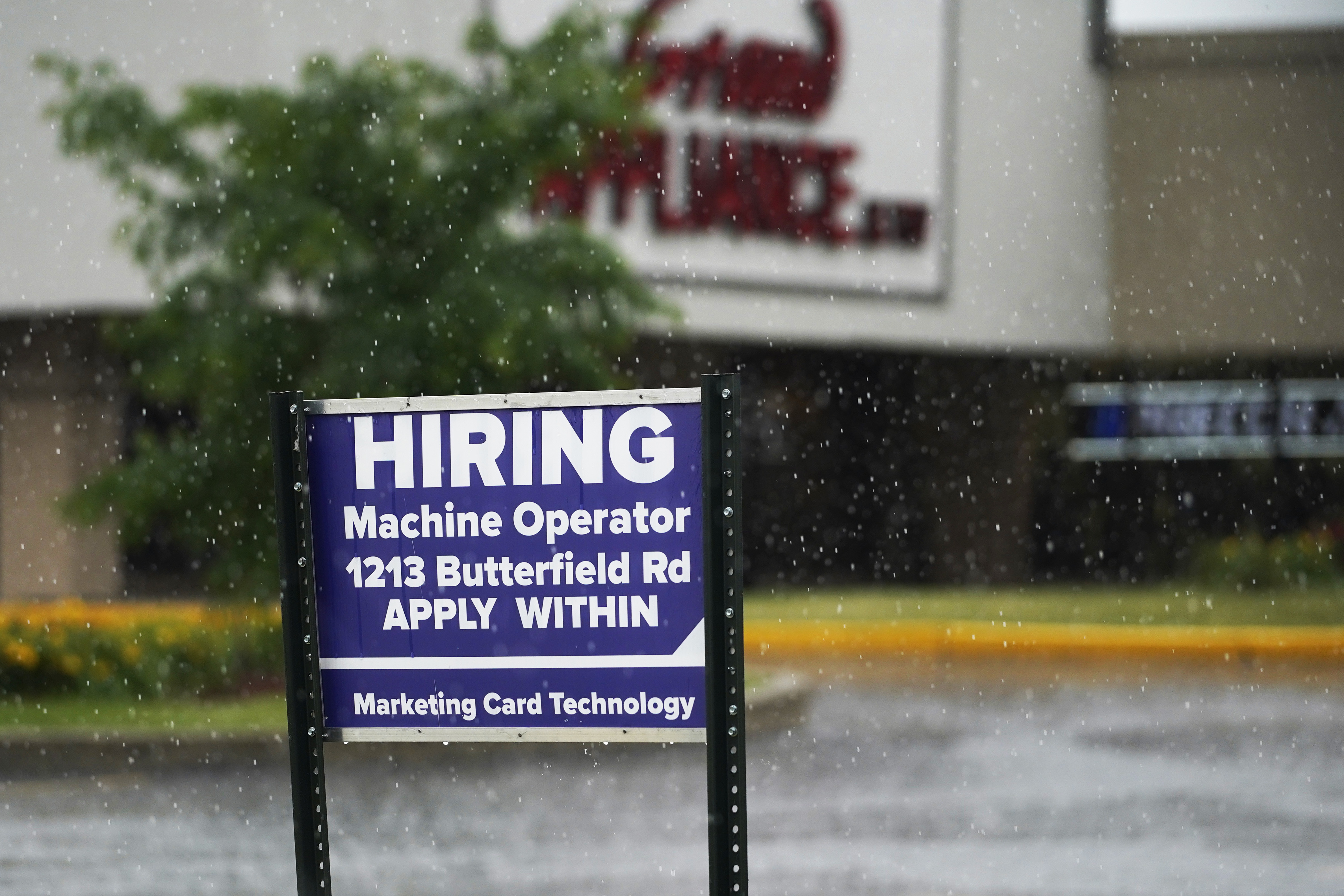 A hiring sign is displayed in Downers Grove, Ill., on June 24, 2021. (AP Photo/Nam Y. Huh, File)