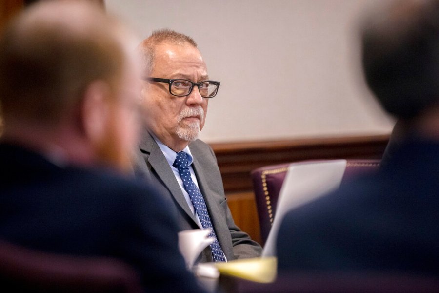 Greg McMichael, center, listens to arguments during the trial of himself, his son Travis McMichael, and a neighbor, William "Roddie" Bryan in the Glynn County Courthouse, Tuesday, Nov. 9, 2021, in Brunswick, Ga. (AP Photo/Stephen B. Morton, Pool)