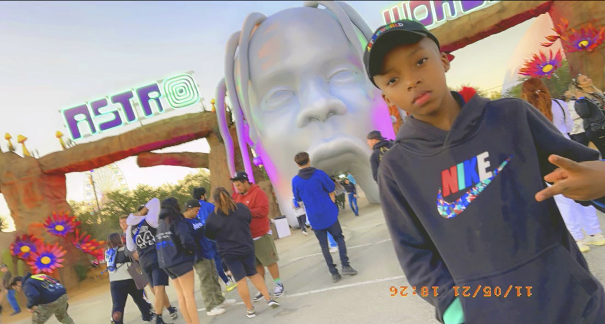 This photo provided by Taylor Blount shows Ezra Blount, 9, posing outside the Astroworld music festival in Houston. Ezra was injured at the concert during a crowd surge. (Courtesy of Taylor Blount via Associated Press)