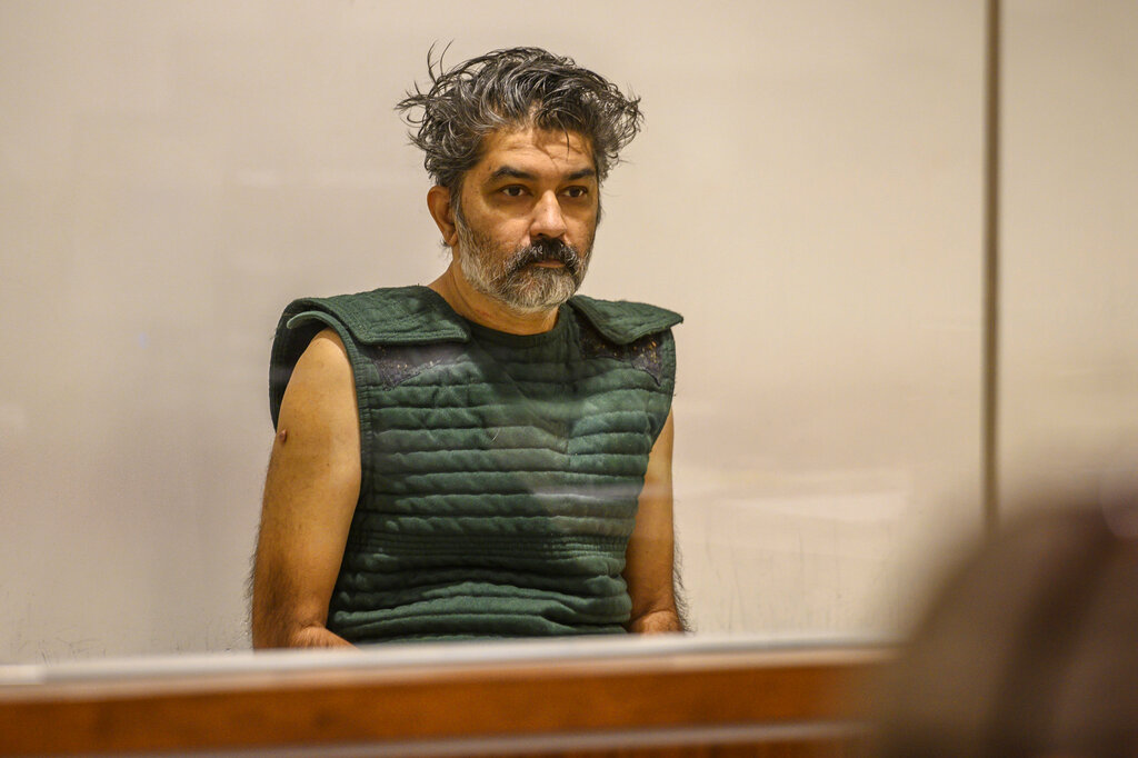 In this Oct. 16, 2019, file photo, Shankar Hangud, wearing a personal safety vest, appears in the Placer County Superior Court in Roseville, Calif. Hangud, 55, who confessed to killing his wife and three sons in 2019, was sentenced Wednesday, Nov. 10, 2021, to life in prison without parole. (Renee C. Byer/The Sacramento Bee via AP, Pool, File)