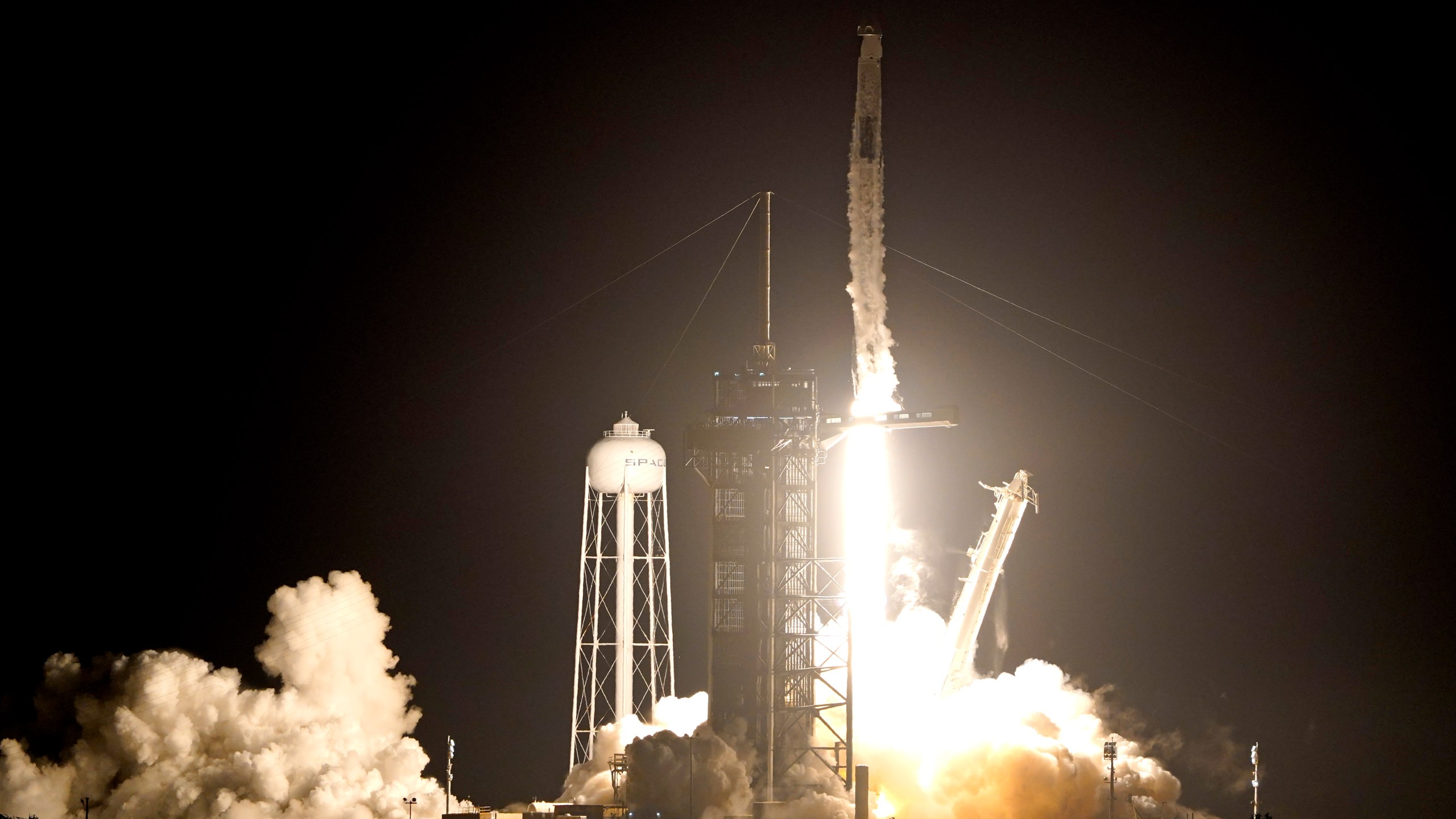 A SpaceX Falcon 9 rocket with the Crew Dragon capsule lifts off from Launch Pad 39A at the Kennedy Space Center in Cape Canaveral, Fla., on Nov. 10, 2021. (AP Photo/John Raoux)