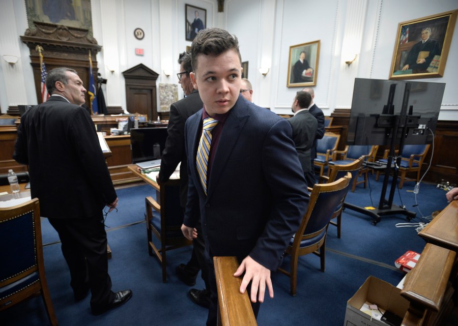 Kyle Rittenhouse, center, enters the courtroom after a break at the Kenosha County Courthouse in Kenosha, Wis., on Nov. 11, 2021. Rittenhouse is accused of killing two people and wounding a third during a protest over police brutality in Kenosha, last year. (Sean Krajacic/The Kenosha News via AP, Pool)