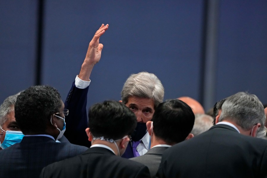 John Kerry, United States Special Presidential Envoy for Climate gestures at the end of a stocktaking plenary session at the COP26 U.N. Climate Summit in Glasgow, Scotland, Saturday, Nov. 13, 2021. (AP Photo/Alastair Grant)