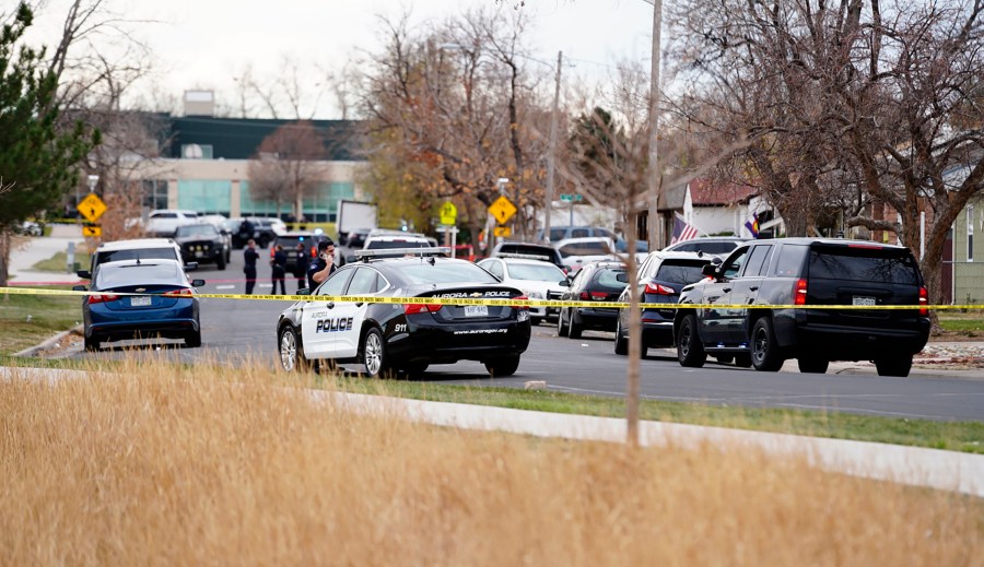 Law enforcement officials survey the scene of a shooting in which six teenagers were injured in a park in Aurora, Colo. on Nov. 15, 2021. (Philip B. Poston/Sentinel Colorado via AP)