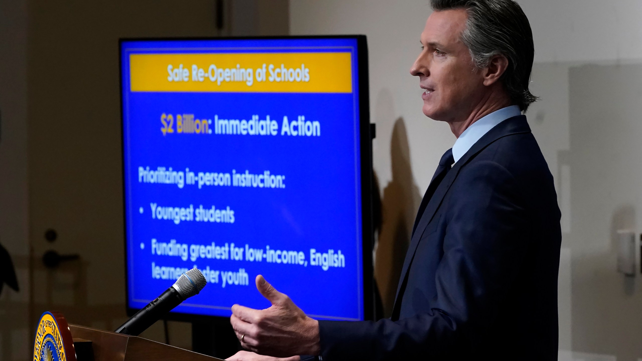 California Gov. Gavin Newsom speaks about his 2021-2022 state budget proposal during a news conference in Sacramento, Calif., on Jan. 8, 2021. California will have a $31 billion budget surplus next year as revenues continue to climb despite the pandemic, according to a new forecast from the state's independent Legislative Analyst's Office. (AP Photo/Rich Pedroncelli, Pool, File)