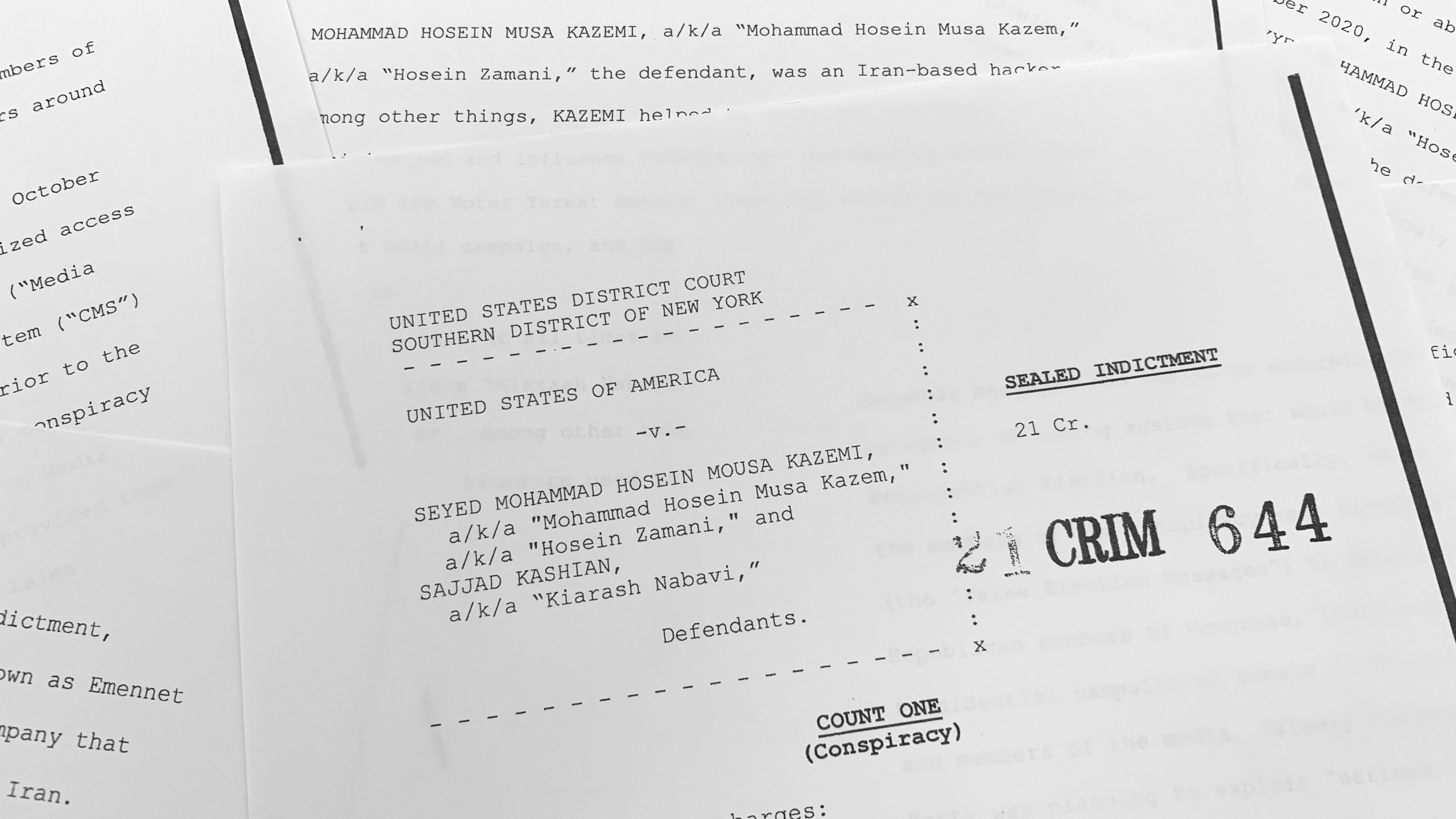 The grand jury indictment against Iranian nationals Seyyed Mohammad Hosein Musa Kazemi and Sajjad Kashian is photographed Thursday, Nov. 18, 2021. The two suspected Iranian computer hackers have been charged with election interference, accused of trying to intimidate American voters ahead of last year's U.S. presidential election by sending threatening messages and spreading disinformation. (AP Photo/Jon Elswick)