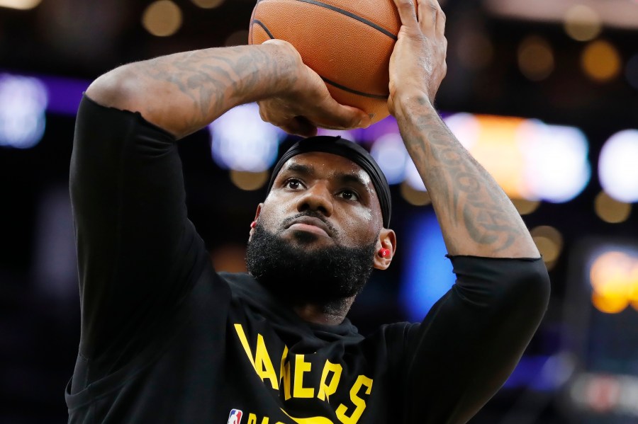 Los Angeles Lakers' LeBron James warms up before an NBA basketball game against the Boston Celtics on Nov. 19, 2021, in Boston. (AP Photo/Michael Dwyer)