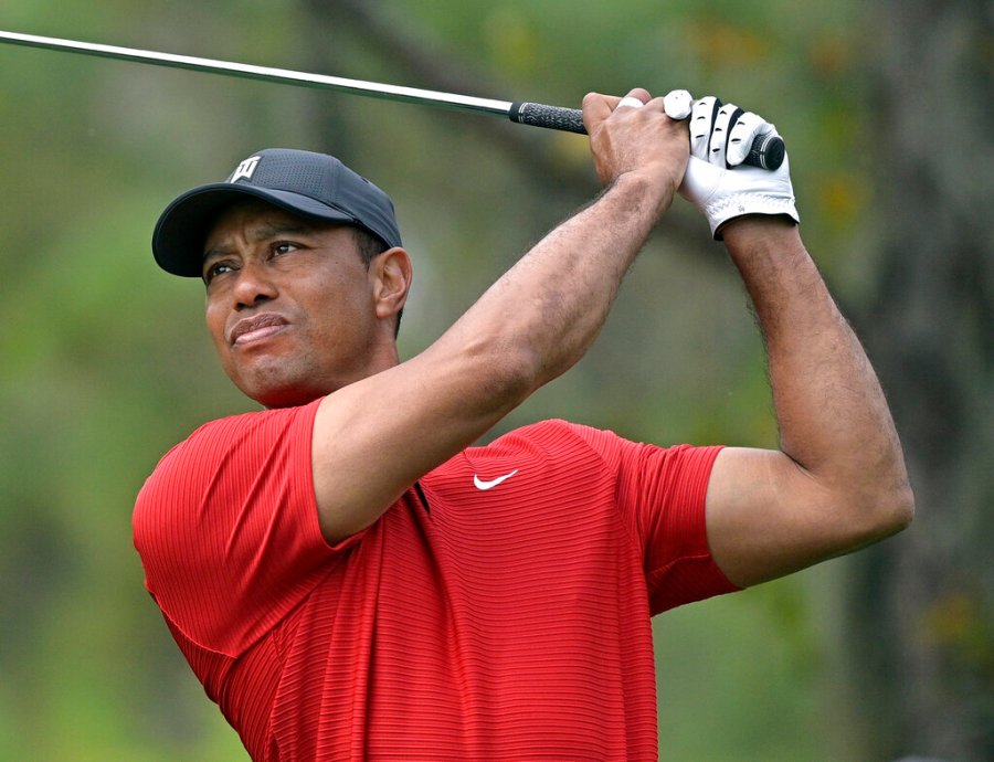 Tiger Woods watches his tee shot on the fourth hole during the final round of the PNC Championship golf tournament Dec. 20, 2020, in Orlando, Fla. (AP Photo/Phelan M. Ebenhack, File)